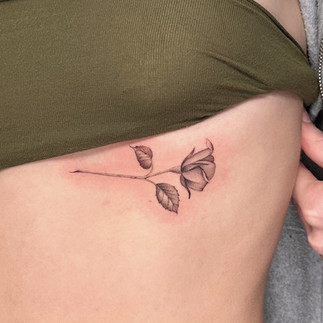 Delicate rose tattoo