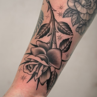 Black and Gray Rose Tattoo on forearm