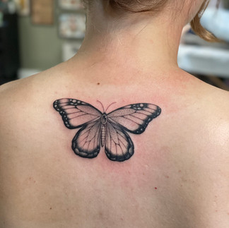 Black and gray butterfly tattoo