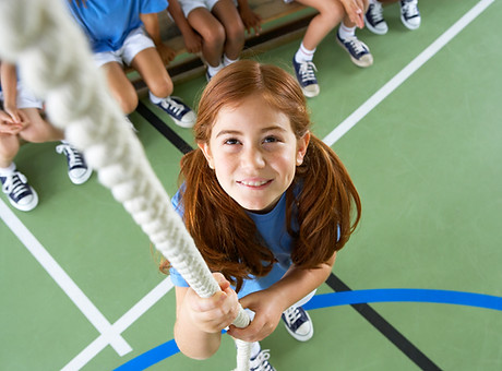 Girl climbing rope