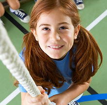 Girl climbing rope