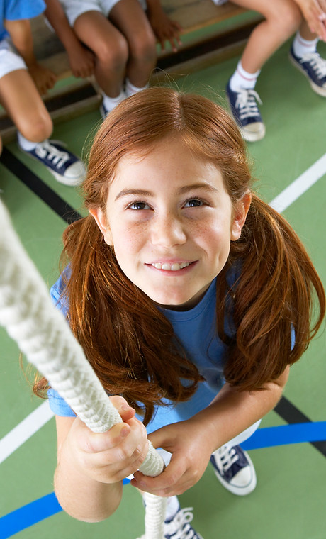 Girl climbing rope