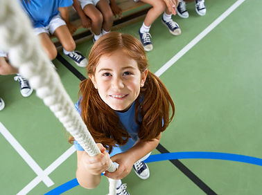 Girl climbing rope