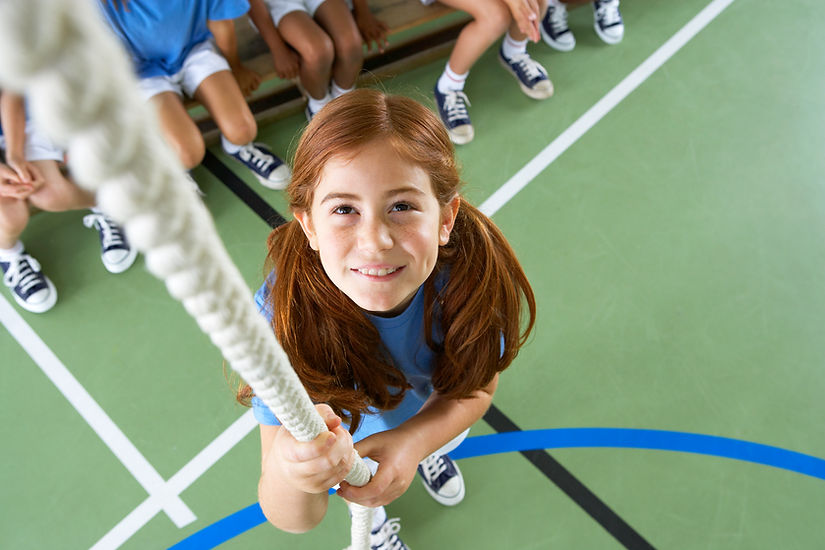 Girl climbing rope