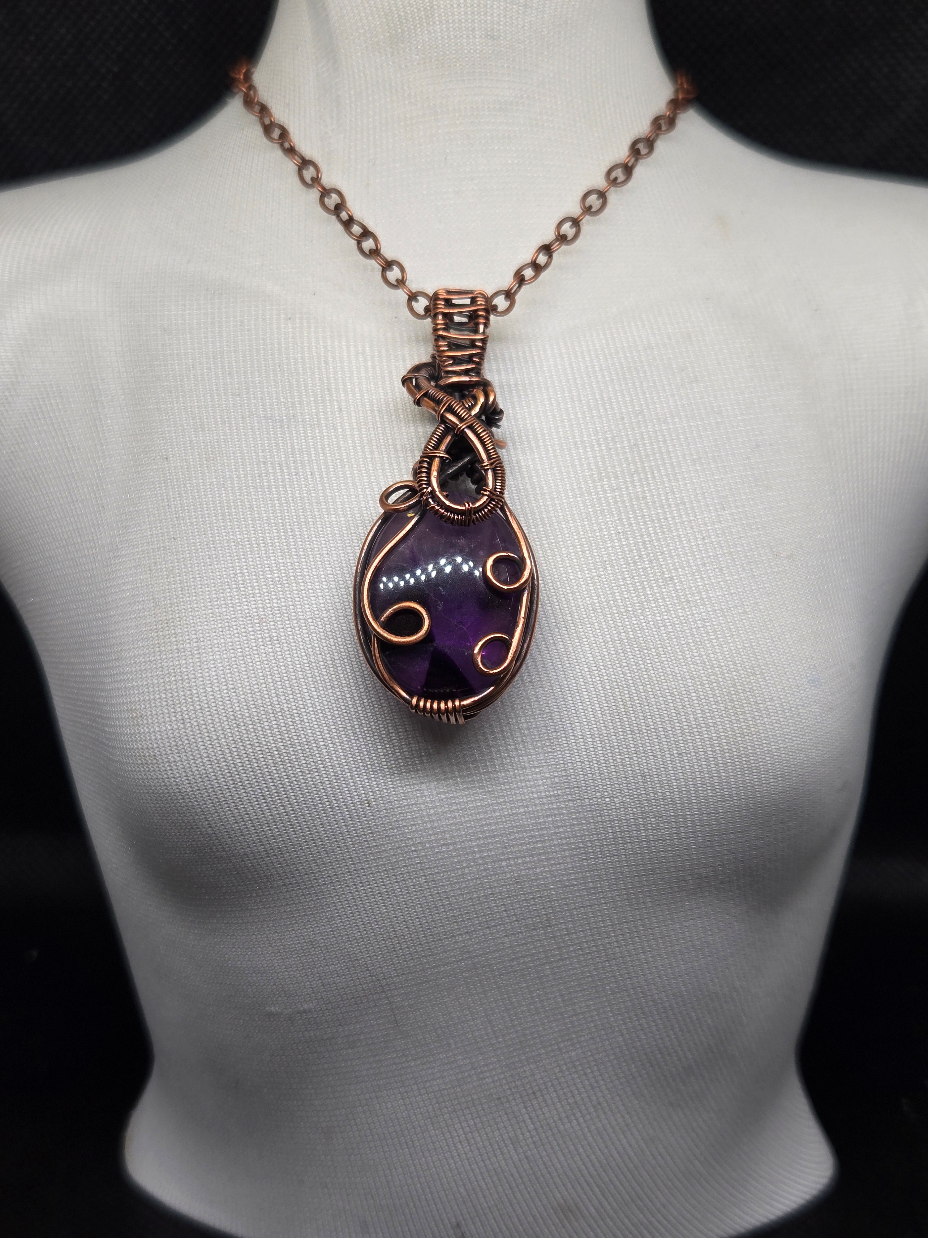 Amethyst, hand wrapped in copper. Pendant, necklace.