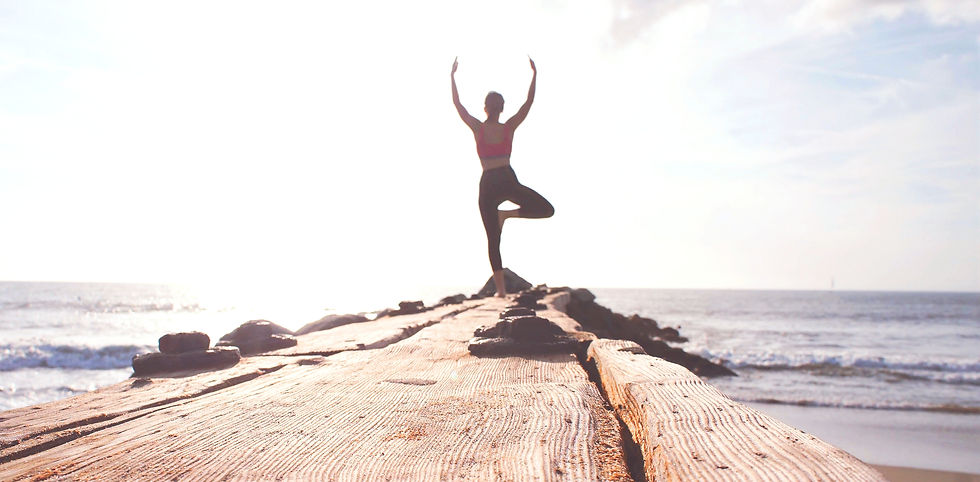 Woman outdoors with arms raised, representing routine chiropractic care and long-term wellness at New York Spinal Correction in New York.