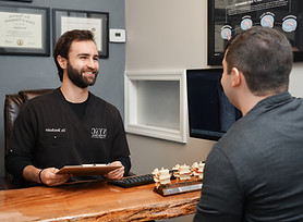 Dr. Kenneth Benfante providing a new patient consultation at New York Spinal Correction in New York.