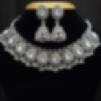 Bohemian style silver finish mirror jewelry set displayed on black bust.