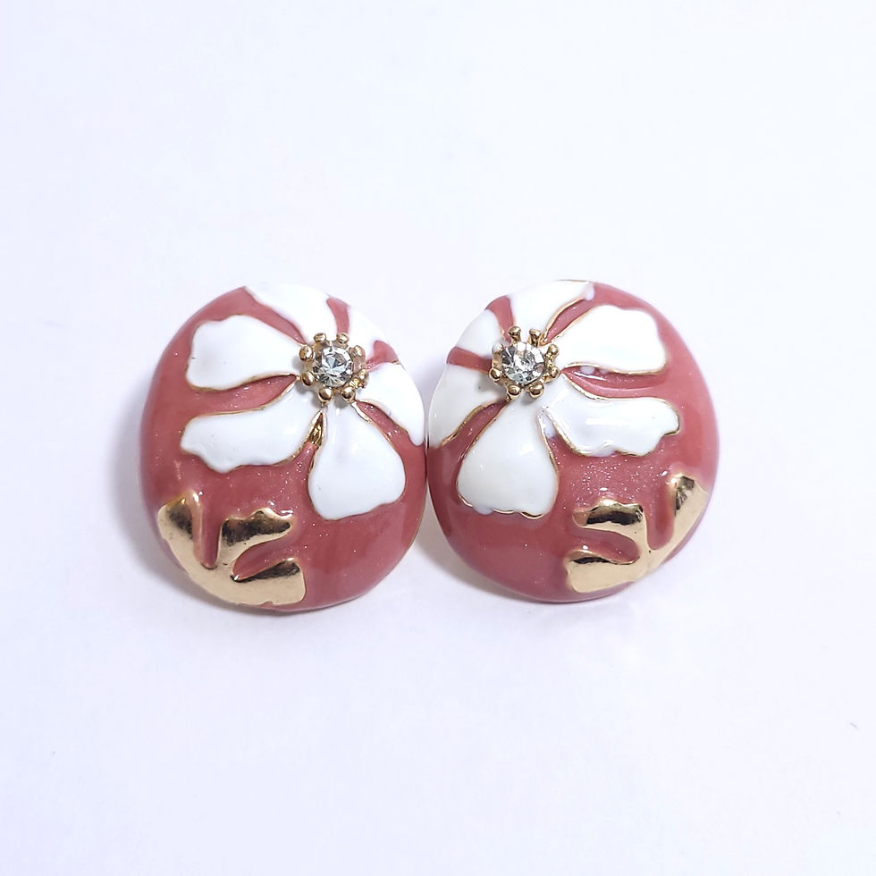 Colorful domed enamel stud earrings with white flower patterns and a central sparkling crystal.