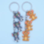 Pair of Mini 3D Tom and Jerry silicone keychains with cascading charms.