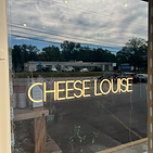 Cheese Louise's neon sign