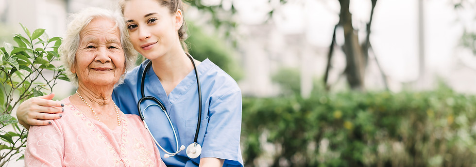 Caregiver with Asian elderly woman outdoor