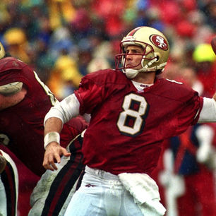 Steve Young in a San Francisco 49ers uniform getting ready to throw a football