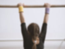 Gymnast on a Wooden Bar