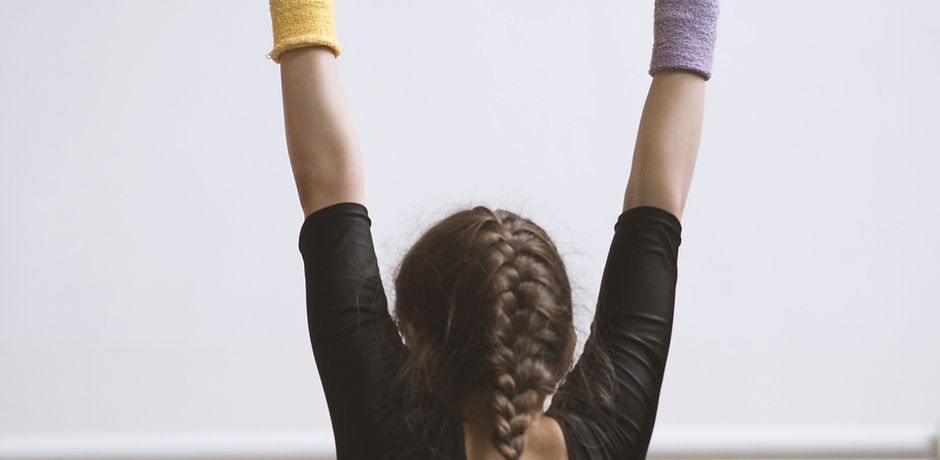 Gymnast on a Wooden Bar