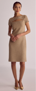 woman in neutral color knee length dress with cut out