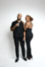 Couple posing for luxury boudoir photography in black attire.