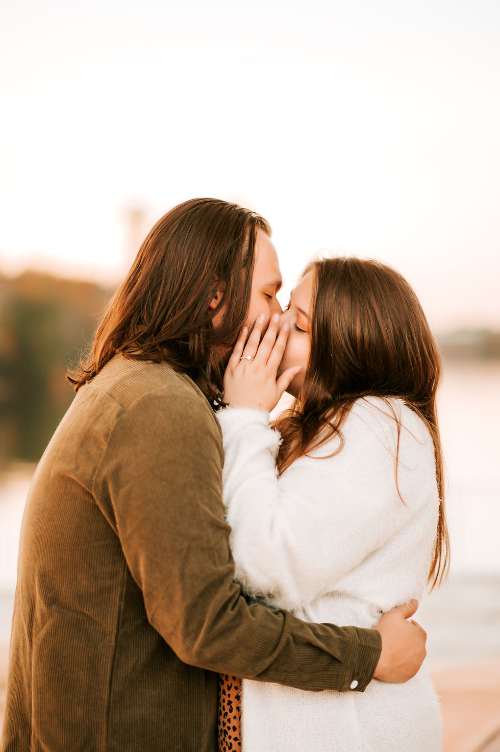 Couple embracing at a local portrait photography studio.