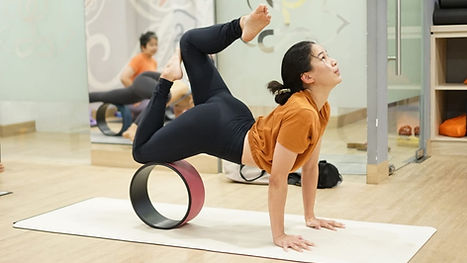 A yoga wheel is a piece of yoga equipment that may be used to aid in a variety of asanas.