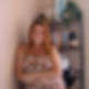 professional photo of a woman standing on front of a bookcase with plants and other decor
