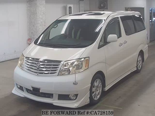 A grey JDM sports car speeding down a highway at night.