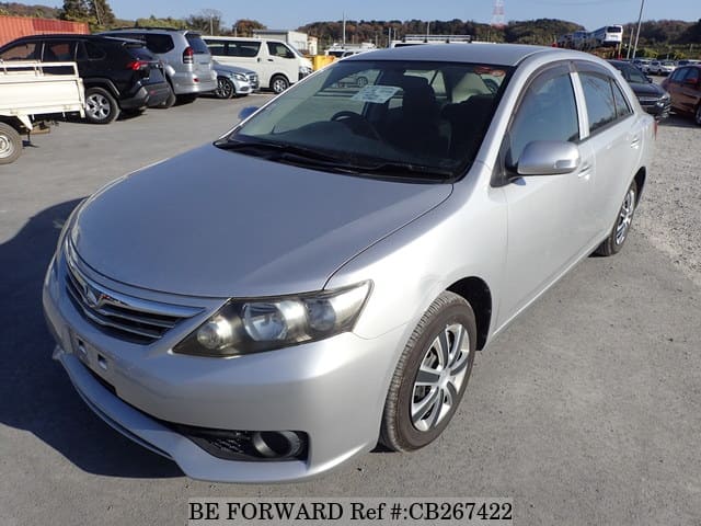 A grey JDM sports car speeding down a highway at night.