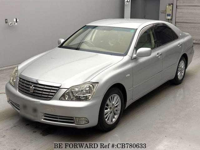 A grey JDM sports car speeding down a highway at night.