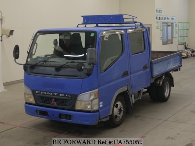 A grey JDM sports car speeding down a highway at night.