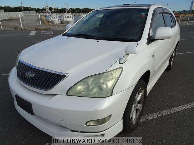 A grey JDM sports car speeding down a highway at night.
