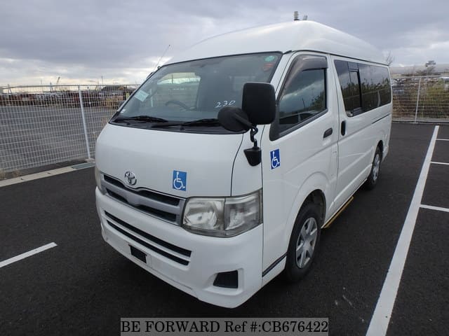 A grey JDM sports car speeding down a highway at night.