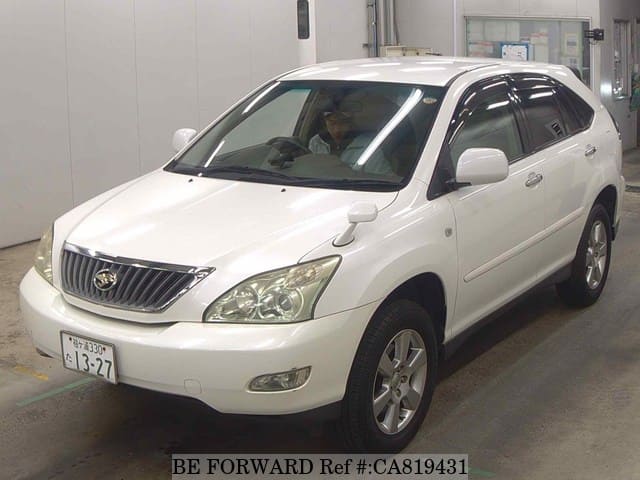 A grey JDM sports car speeding down a highway at night.