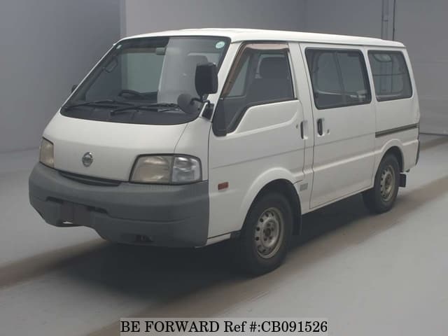 A grey JDM sports car speeding down a highway at night.