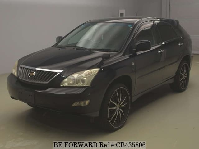 A grey JDM sports car speeding down a highway at night.