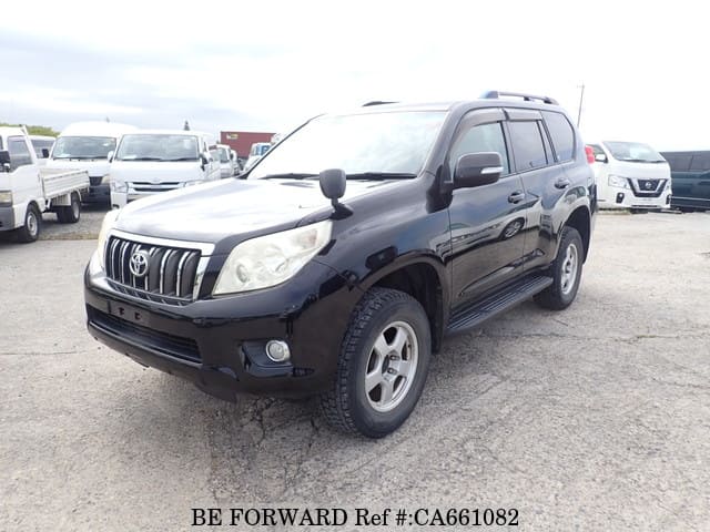 A grey JDM sports car speeding down a highway at night.