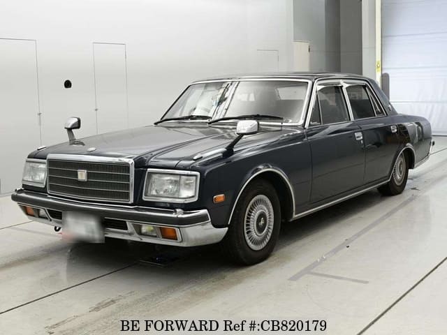 A grey JDM sports car speeding down a highway at night.