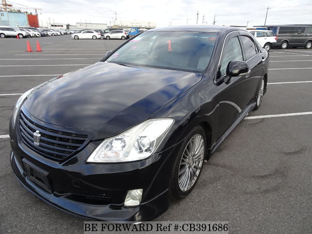 A grey JDM sports car speeding down a highway at night.