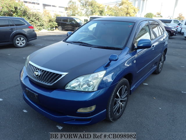 A grey JDM sports car speeding down a highway at night.