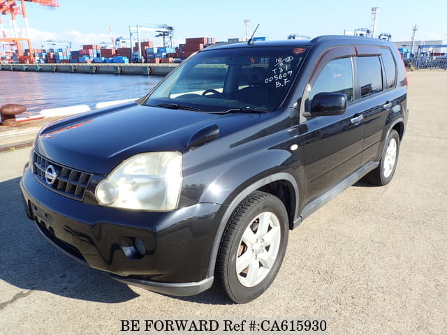 A grey JDM sports car speeding down a highway at night.