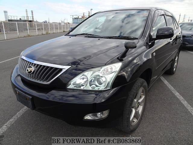 A grey JDM sports car speeding down a highway at night.