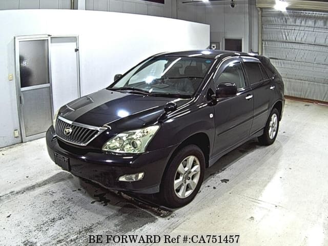 A grey JDM sports car speeding down a highway at night.