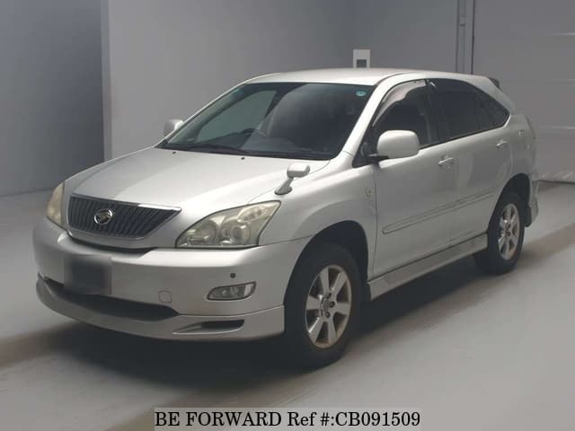 A grey JDM sports car speeding down a highway at night.