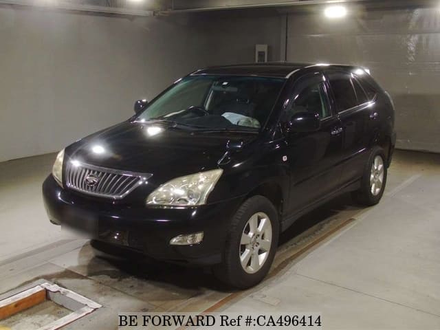 A grey JDM sports car speeding down a highway at night.