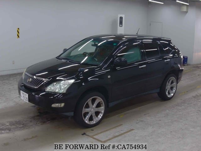 A grey JDM sports car speeding down a highway at night.