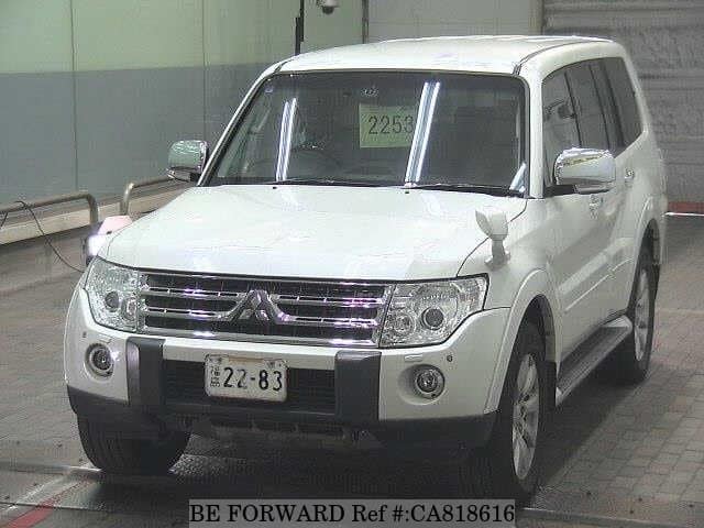 A grey JDM sports car speeding down a highway at night.