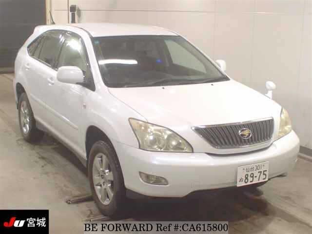 A grey JDM sports car speeding down a highway at night.
