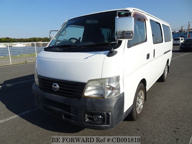 A grey JDM sports car speeding down a highway at night.