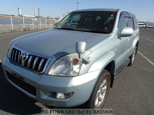A grey JDM sports car speeding down a highway at night.