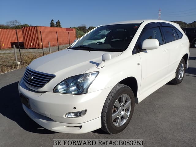 A grey JDM sports car speeding down a highway at night.