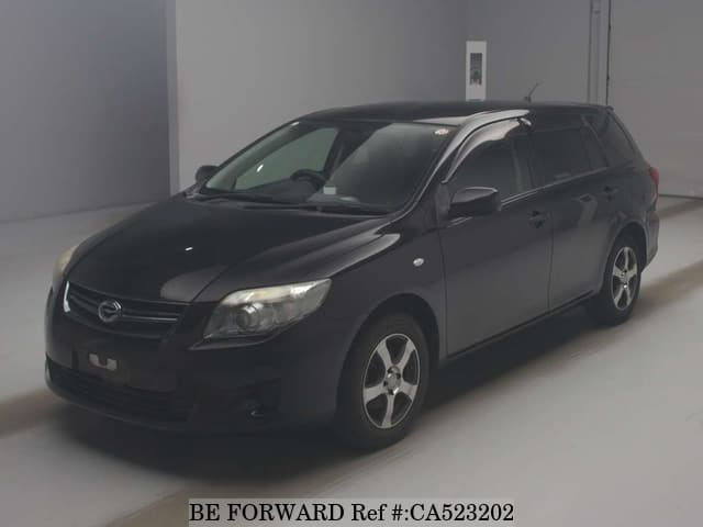 A grey JDM sports car speeding down a highway at night.