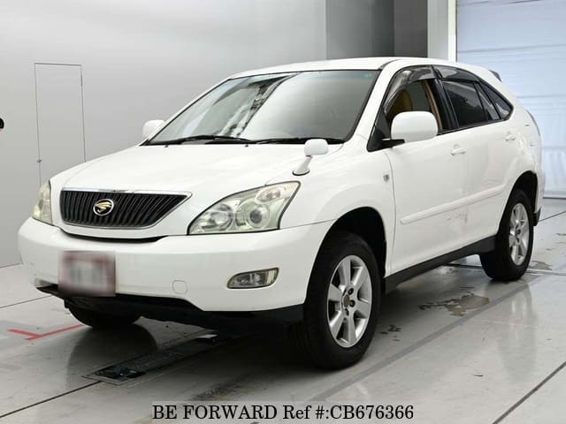 A grey JDM sports car speeding down a highway at night.